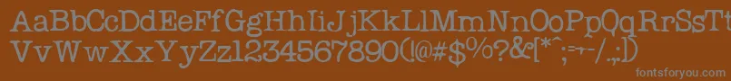 フォントProblemSecretaryNormal – 茶色の背景に灰色の文字