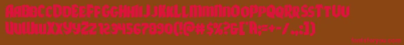 フォントXmasxpress – 赤い文字が茶色の背景にあります。