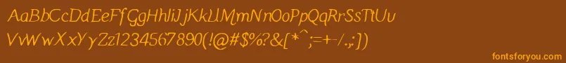 Manicmondayregular Font – Orange Fonts on Brown Background