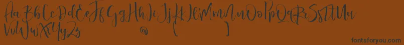Шрифт ValairyaPersonalUse – чёрные шрифты на коричневом фоне