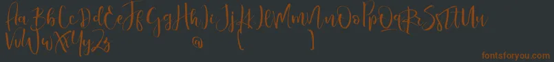 ValairyaPersonalUse-Schriftart – Braune Schriften auf schwarzem Hintergrund