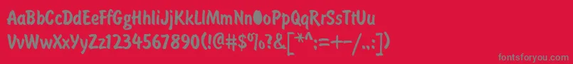 フォントDomcasualNormal – 赤い背景に灰色の文字