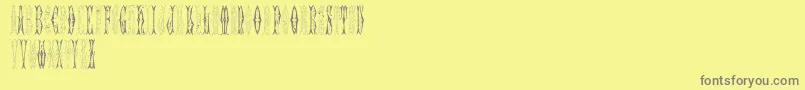 SajouFancyGothic-Schriftart – Graue Schriften auf gelbem Hintergrund