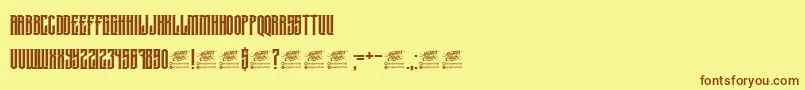 フォントMcfKrechet – 茶色の文字が黄色の背景にあります。