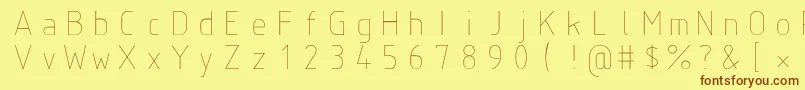 フォントIsoct – 茶色の文字が黄色の背景にあります。