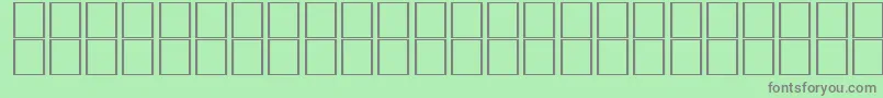 フォントAlKharashi10 – 緑の背景に灰色の文字