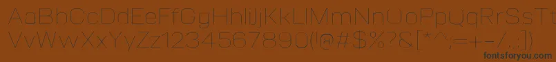フォントVitroUltralight – 黒い文字が茶色の背景にあります