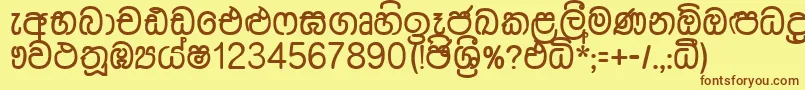 フォントDusharnbi – 茶色の文字が黄色の背景にあります。