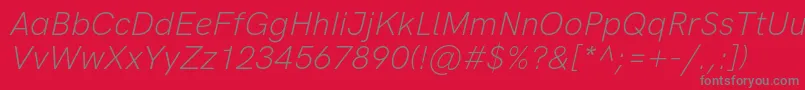 HkgroteskLightitalic-Schriftart – Graue Schriften auf rotem Hintergrund