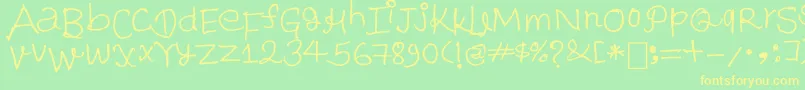 フォントParesh – 黄色の文字が緑の背景にあります