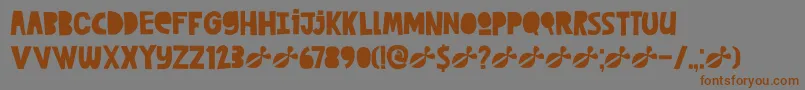 DkCutAlong-Schriftart – Braune Schriften auf grauem Hintergrund