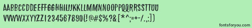 フォントMarchOfThePigs – 緑の背景に黒い文字