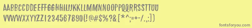 フォントMarchOfThePigs – 黄色の背景に灰色の文字