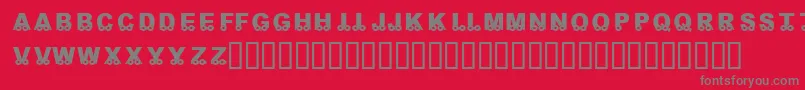 KrOnTheGo-fontti – harmaat kirjasimet punaisella taustalla