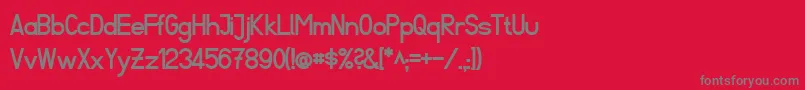 フォントFibelSuedBold – 赤い背景に灰色の文字