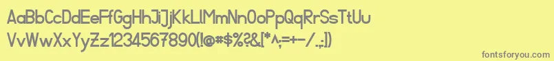 フォントFibelSuedBold – 黄色の背景に灰色の文字