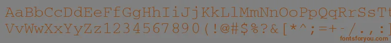 フォントCouriermcyRegular – 茶色の文字が灰色の背景にあります。