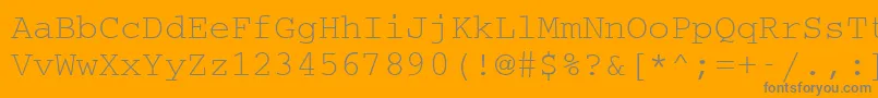 CouriermcyRegular-fontti – harmaat kirjasimet oranssilla taustalla