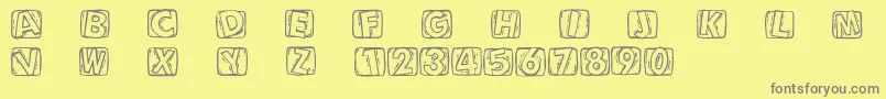 Woodcuttedcaps Font – Gray Fonts on Yellow Background