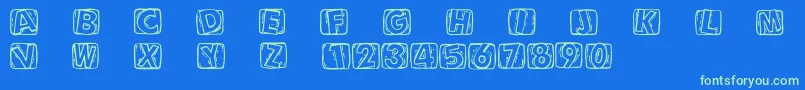 Woodcuttedcaps Font – Green Fonts on Blue Background