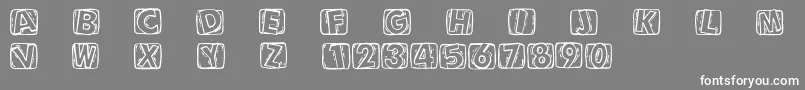Woodcuttedcaps Font – White Fonts on Gray Background