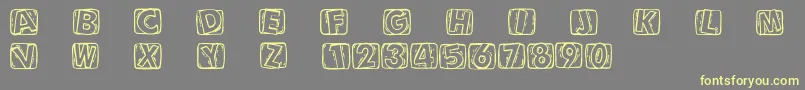 Woodcuttedcaps-Schriftart – Gelbe Schriften auf grauem Hintergrund
