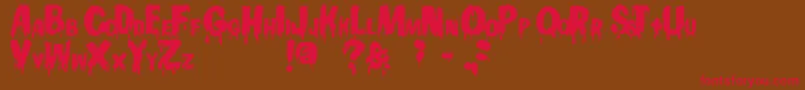 フォントGooey – 赤い文字が茶色の背景にあります。