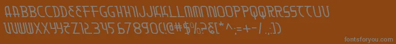 Moondartl-fontti – harmaat kirjasimet ruskealla taustalla
