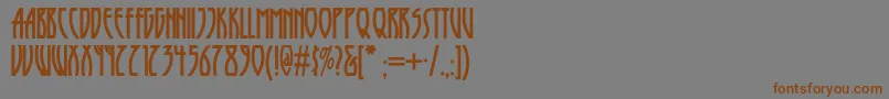フォントRunytunesrevisitednf – 茶色の文字が灰色の背景にあります。