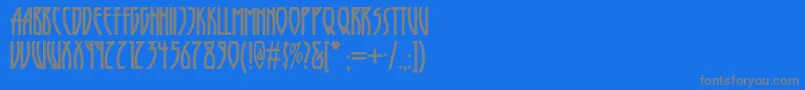 フォントRunytunesrevisitednf – 青い背景に灰色の文字