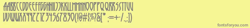 Шрифт Runytunesrevisitednf – серые шрифты на жёлтом фоне