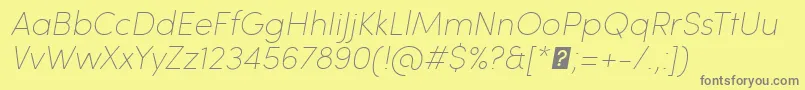 SofiaProUltralightItalic-fontti – harmaat kirjasimet keltaisella taustalla