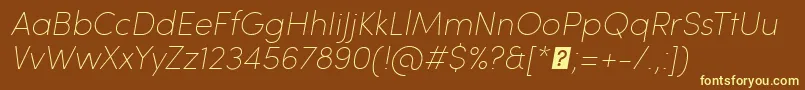 SofiaProUltralightItalic-fontti – keltaiset fontit ruskealla taustalla