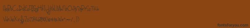 BlueberryOatmealRegular-Schriftart – Schwarze Schriften auf braunem Hintergrund