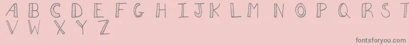 Aezdots Font – Gray Fonts on Pink Background