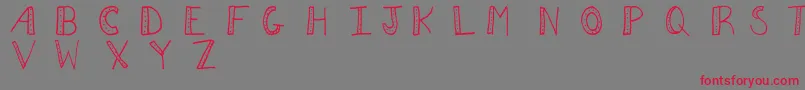 Aezdots Font – Red Fonts on Gray Background