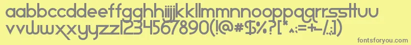 Staravenue-fontti – harmaat kirjasimet keltaisella taustalla