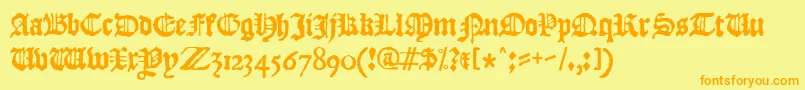 フォントJslBlackletter – オレンジの文字が黄色の背景にあります。