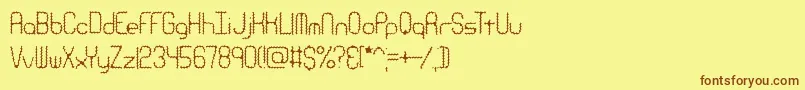 Fonte RavenousCaterpillarBrk – fontes marrons em um fundo amarelo