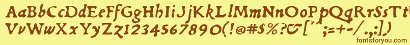 フォントDuBellayItalic – 茶色の文字が黄色の背景にあります。