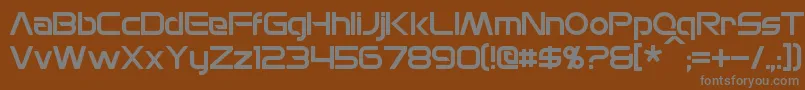 MonsOlympia-fontti – harmaat kirjasimet ruskealla taustalla