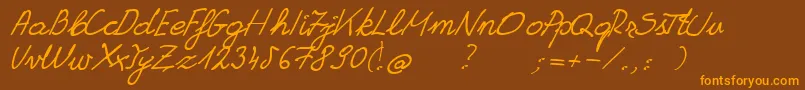 GrannysHandwriting Font – Orange Fonts on Brown Background