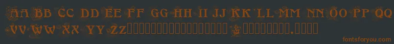 Шрифт Floralcapsnouveau – коричневые шрифты на чёрном фоне
