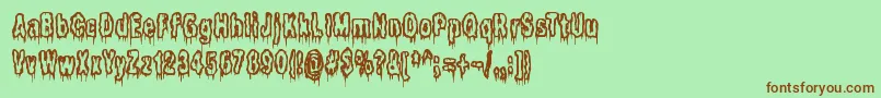 ItLivesInTheSwampBrk-Schriftart – Braune Schriften auf grünem Hintergrund