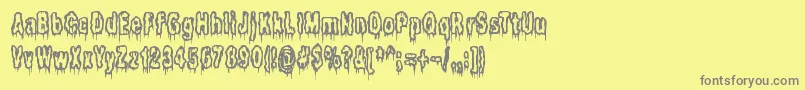 フォントItLivesInTheSwampBrk – 黄色の背景に灰色の文字