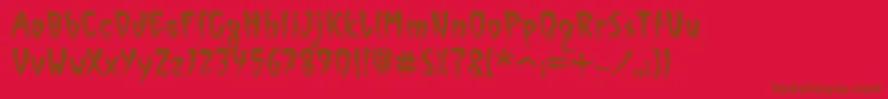 Fonte VinylSawtoothItcTt – fontes marrons em um fundo vermelho