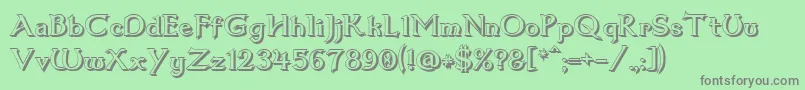 フォントDum1shad – 緑の背景に灰色の文字