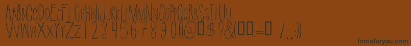 SuicidedraftRegular Font – Black Fonts on Brown Background