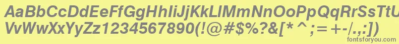 GenevaBoldOblique-fontti – harmaat kirjasimet keltaisella taustalla