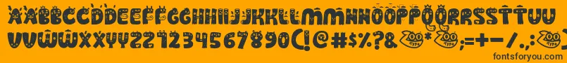 Guakala-Schriftart – Schwarze Schriften auf orangefarbenem Hintergrund